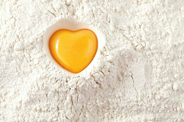 heart-shaped-egg-yolk-on-flour